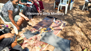 Girls learning how to make handcraft shoes