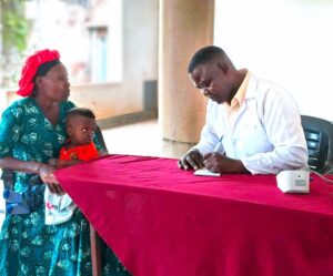 Our Doctor attending to the patient
