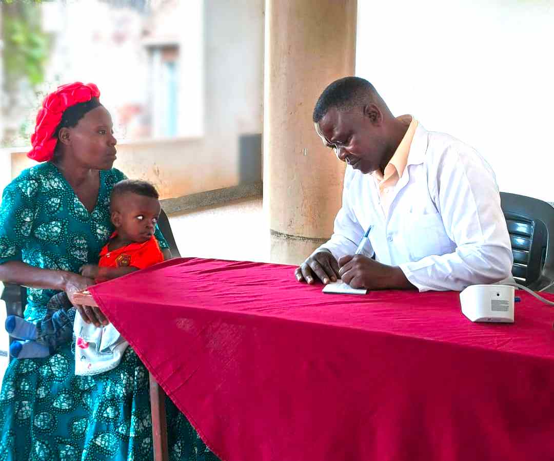 Our Doctor attending to the patient